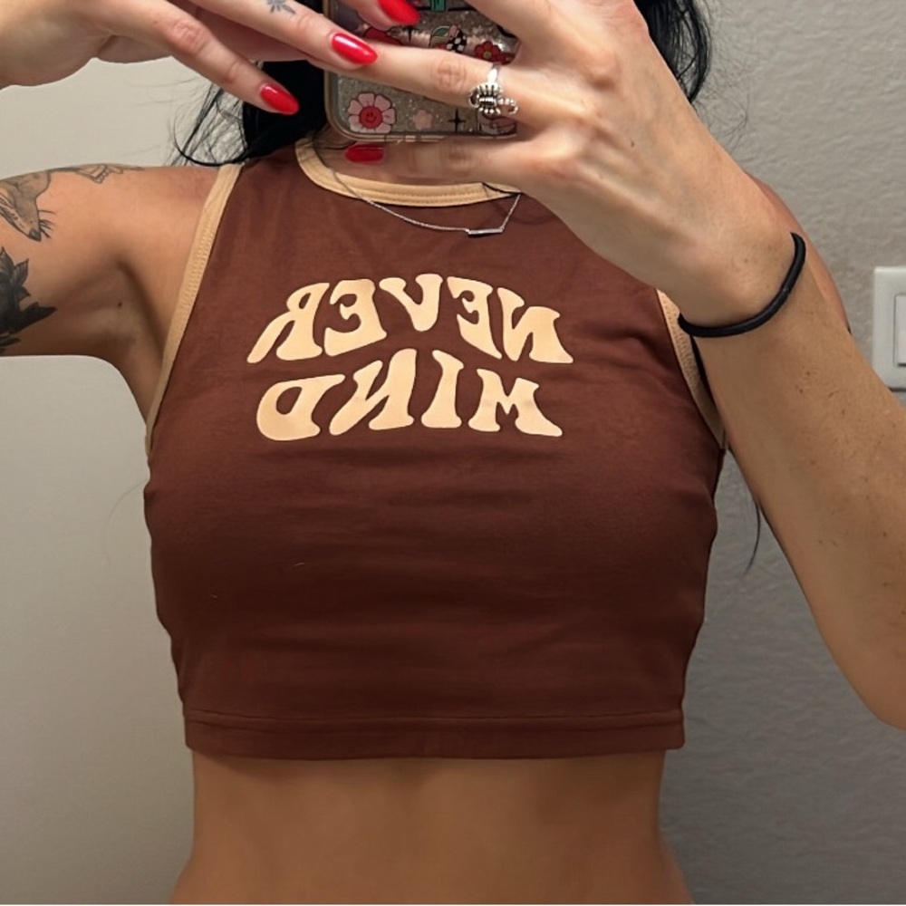 Brown tank “never mind” cropped